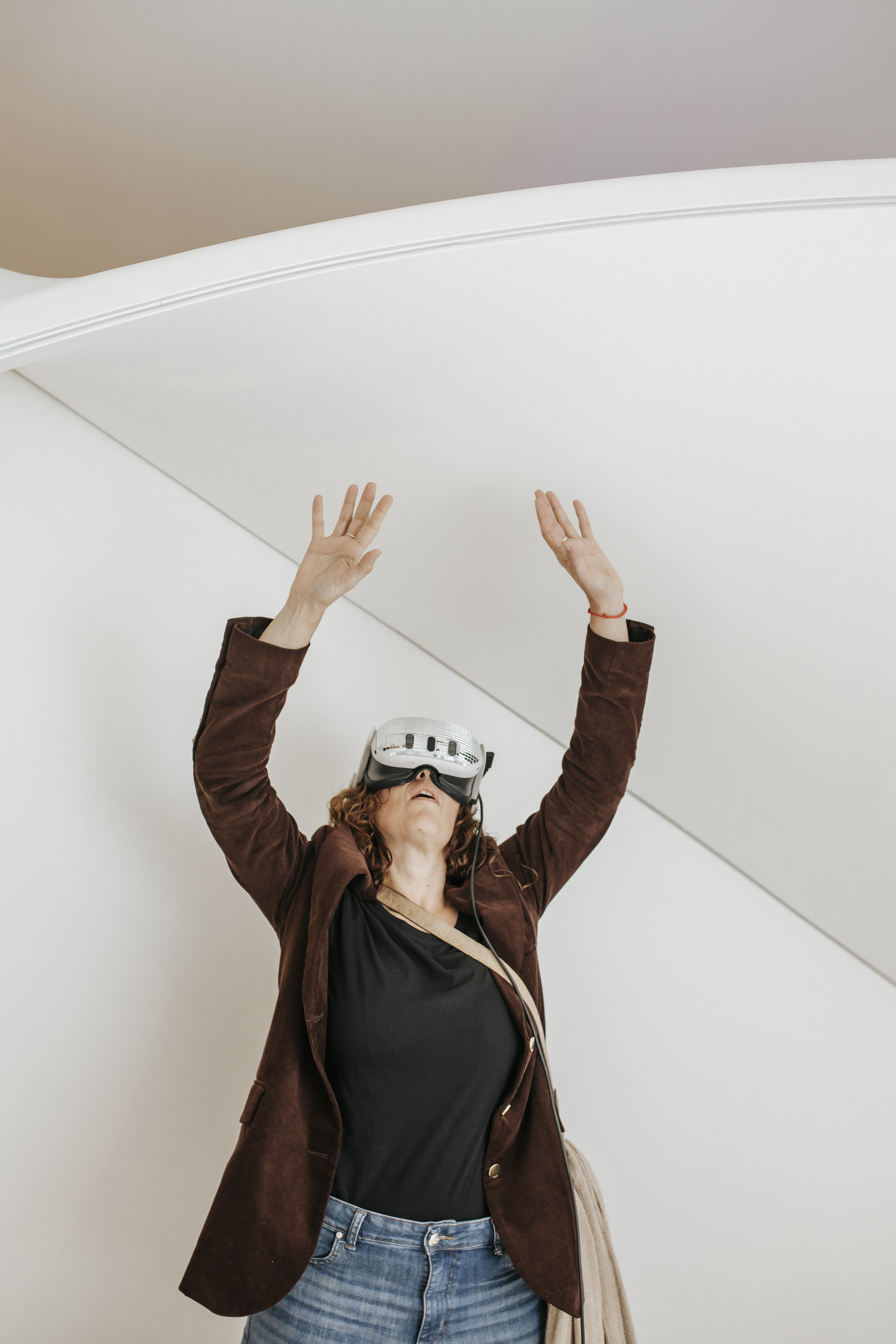 Visitor reaching up in VR space